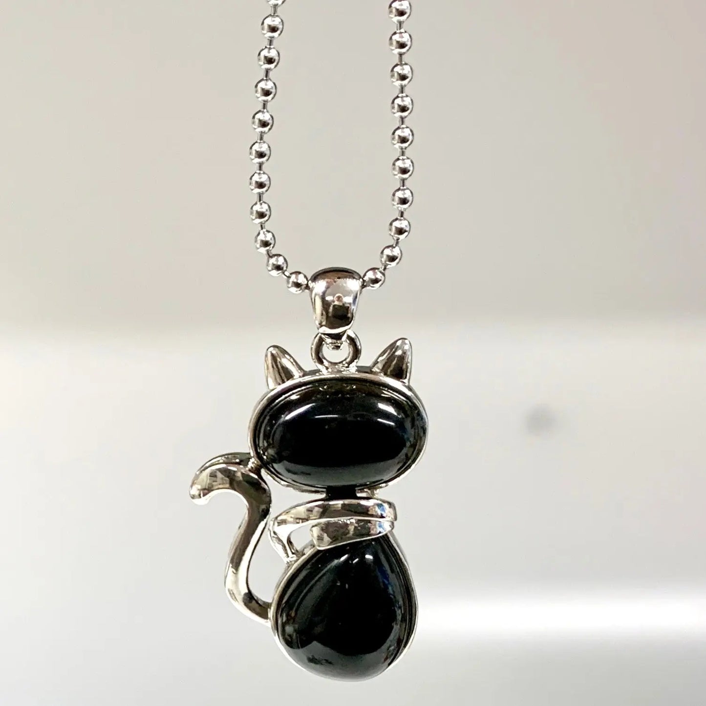 Kissakaulakoru - Musta obsidiaani 4,5cm + ketju 60cm - Valkoisen Liekin Voima