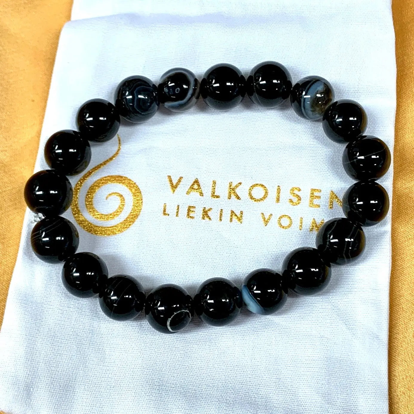 Musta raita - akaatti - Rannekoru - Kohottaa kehon värähtelyä, tuo hyvät yöunet - Valkoisen Liekin Voima