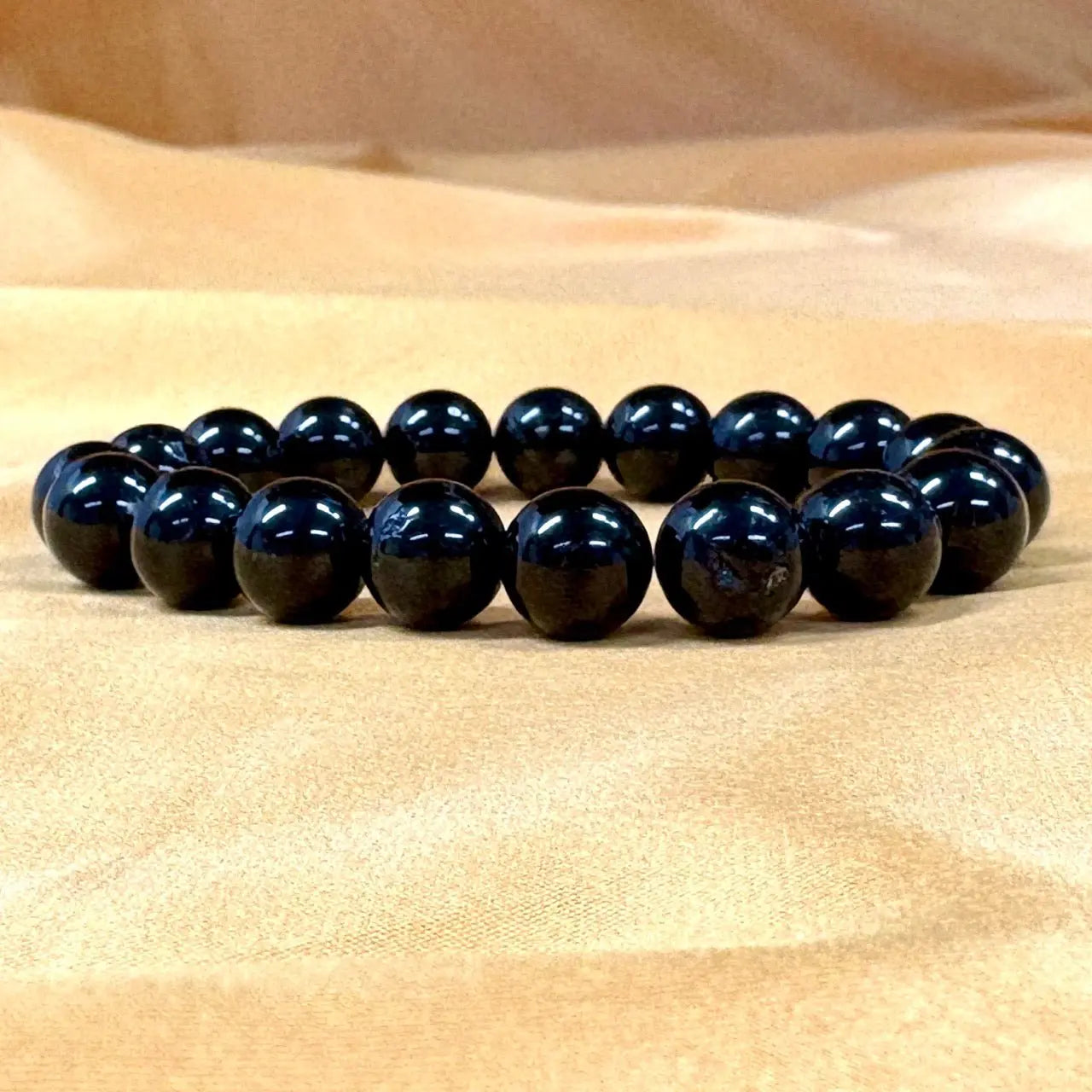 Musta turmaliini - Rannekoru - Suojeleva koru, joka imee negatiivisuuden ja tuo rauhan - Valkoisen Liekin Voima