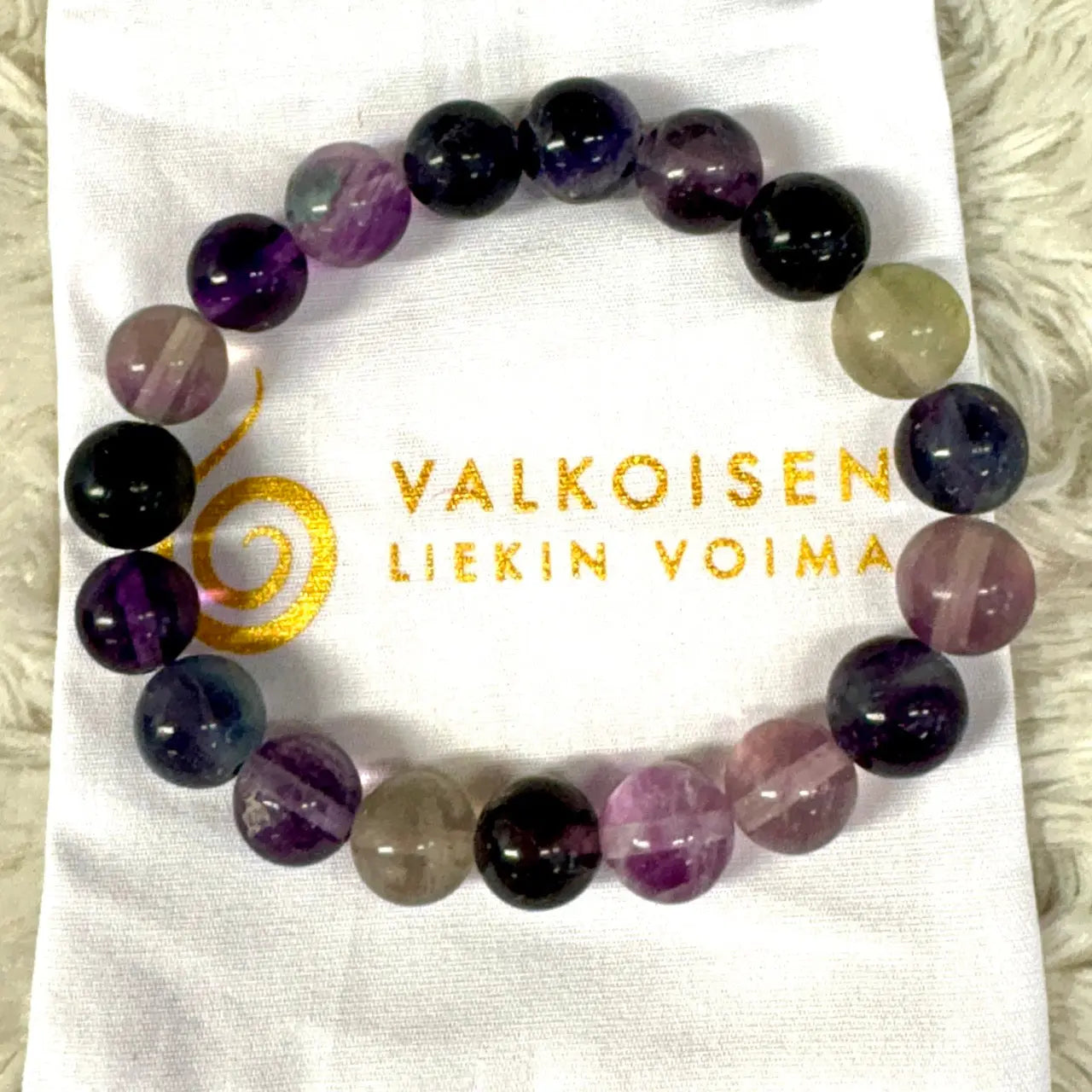 Purppurafluoriitti - Rannekoru - Auttaa päästämään irti jumiutuneista ajatusmalleista Valkoisen Liekin Voima