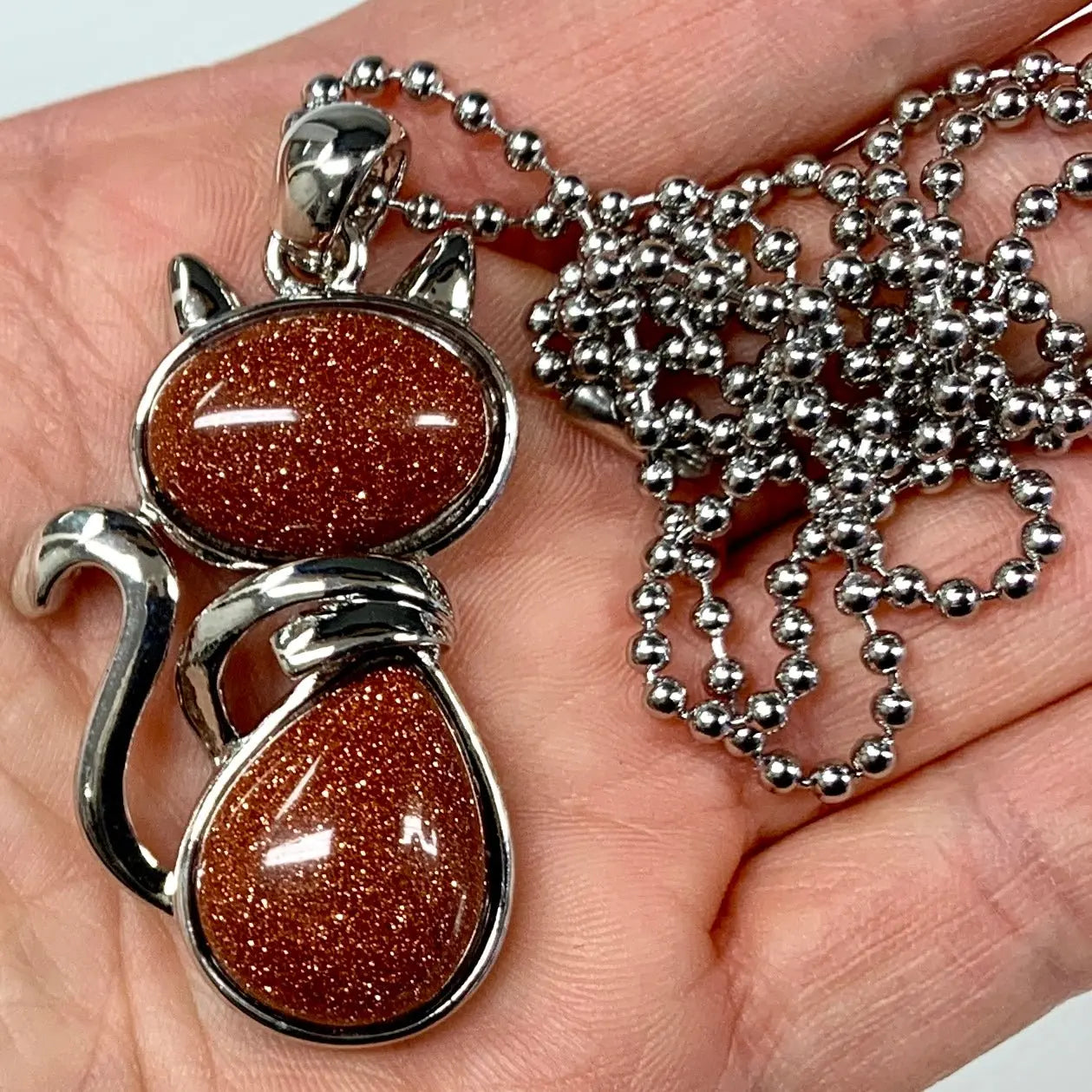 Kissakaulakoru - Kultainen hiekkakivi 4,5cm + ketju 60cm - Valkoisen Liekin Voima