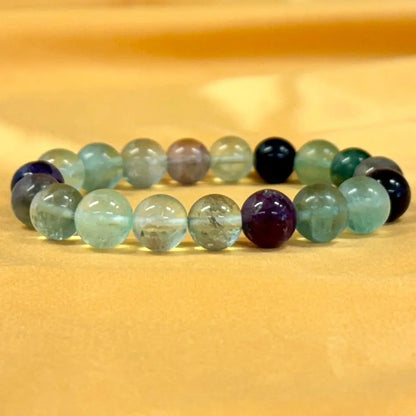 Sateenkaarifluoriitti - Rannekoru - Vapauttaa riippuvuuksista ja turhasta tunnekuormasta Valkoisen Liekin Voima