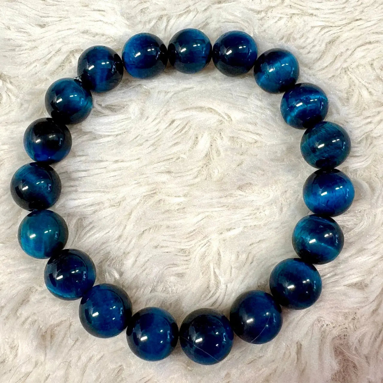 Sininen Tiikerinsilmä - Rannekoru - Vahvistaa energiavirtauksia kehossa - Valkoisen Liekin Voima