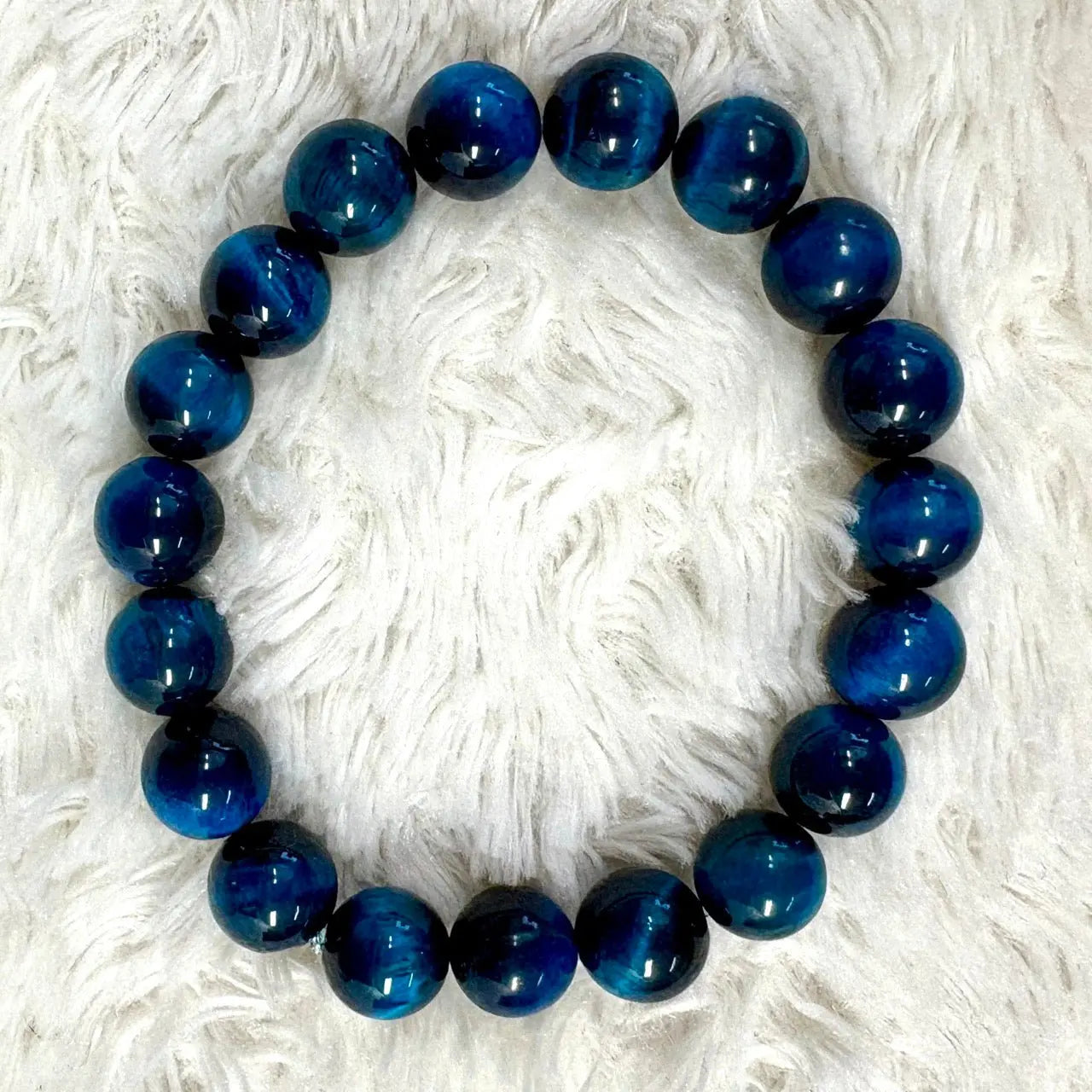 Sininen Tiikerinsilmä - Rannekoru - Vahvistaa energiavirtauksia kehossa - Valkoisen Liekin Voima